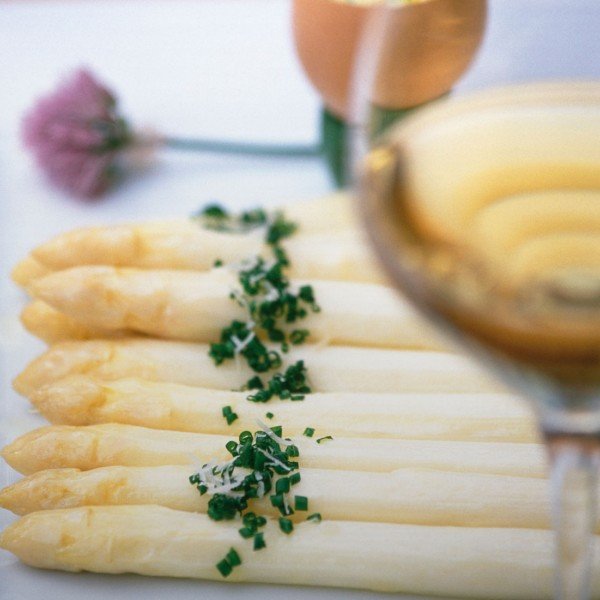 Asparagus dish with a glass white wine